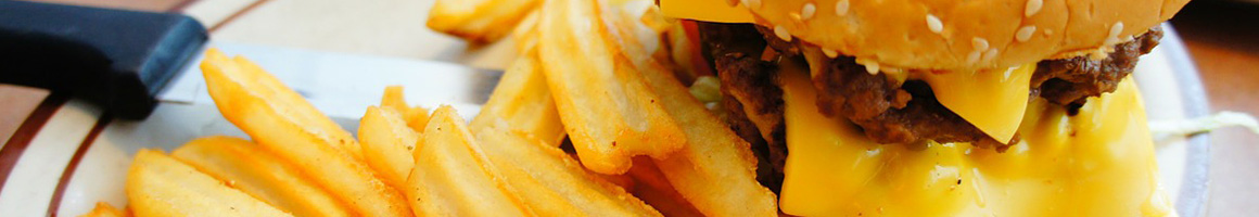 Eating Burger Fast Food at Swensons Drive-In restaurant in Seven Hills, OH.